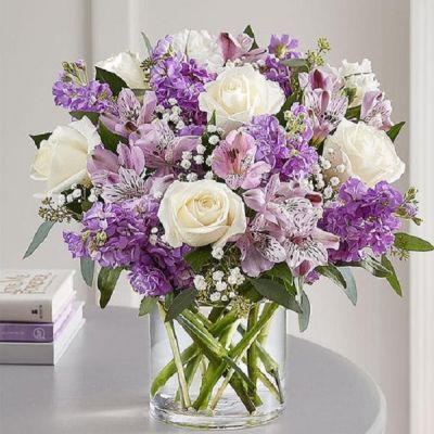 <p>Lovely memories are made with thoughtful gifts for the ones we care about. Our charming bouquet is loosely gathered with a medley of lavender & white blooms. Hand-designed inside a clear cylinder vase with cascading greenery all around, it’s a wonderful way to express the sentiments you have inside your heart.</p>